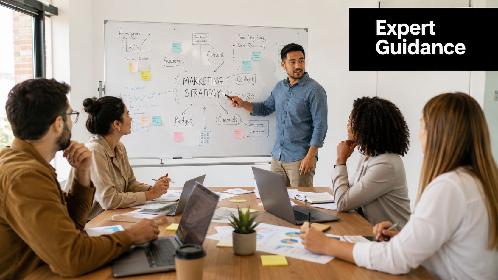 A professional team collaborating on a marketing strategy in a modern office meeting room setting.